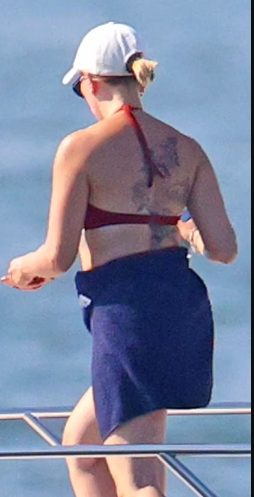 Scarlett had a great time at the beach with her husband in a lovely red bikini