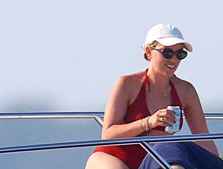Scarlett had a great time at the beach with her husband in a lovely red bikini