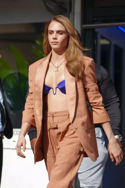 Kara is not shy about going out in just a bra. Photos