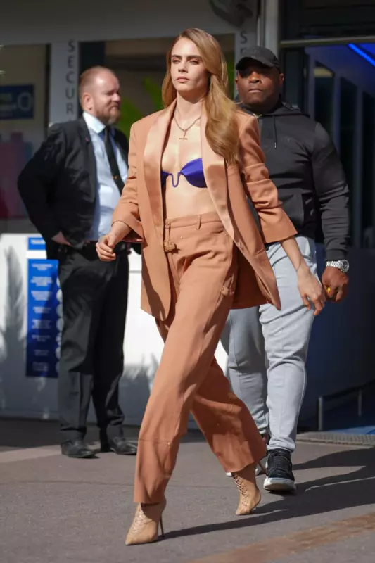 Kara is not shy about going out in just a bra. Photos