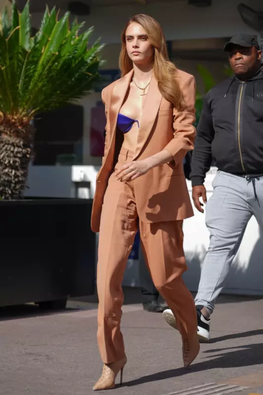 Kara is not shy about going out in just a bra. Photos