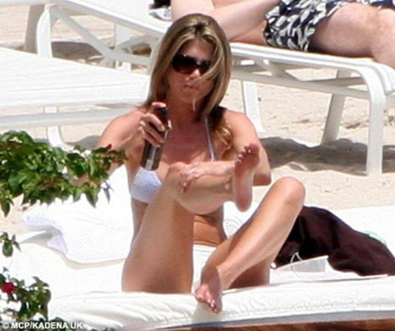 Jenn puts on her famous bikini for a photo shoot. No attempt to hide something