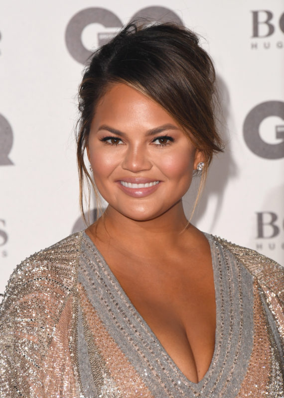 Chrissy fans have questions after she posted a photo in a bikini with a big belly