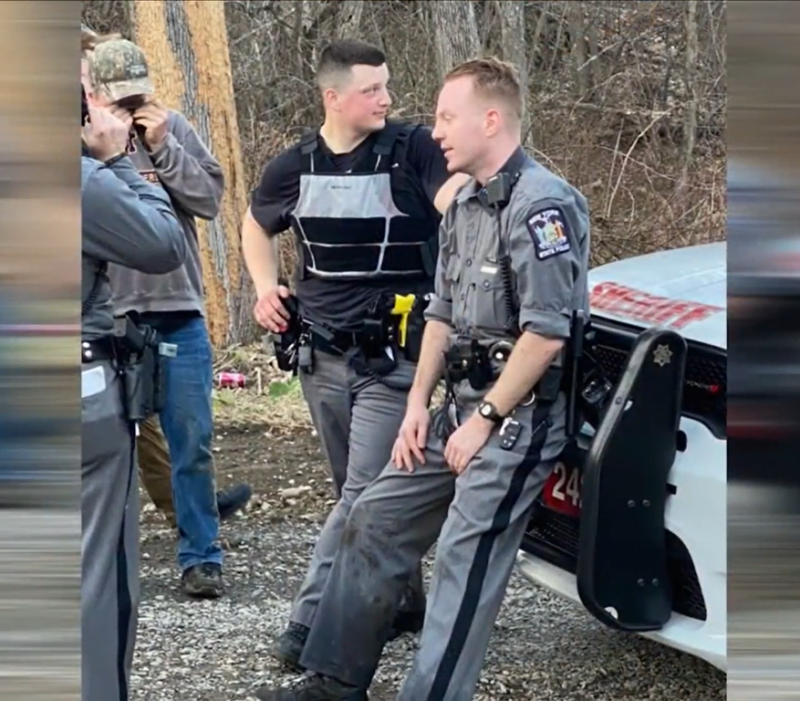 Despite the darkness, a state trooper locates a missing 2-year-old who clings to him and won't let go