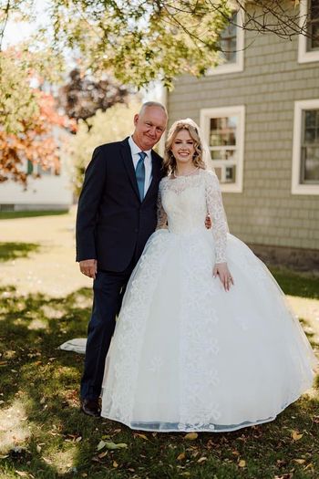 Bride walks down the aisle in her grandmother's 1961 wedding gown, which she kept in a garbage bag