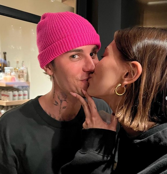 Justin Bieber holds wife Hailey Bieber's baby bump in new pda photo