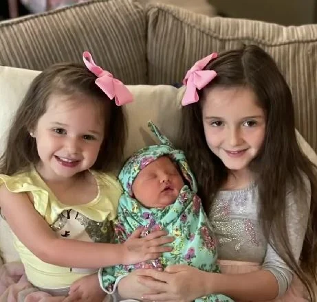 Mom is astounded that her three daughters were born three years apart on the same date