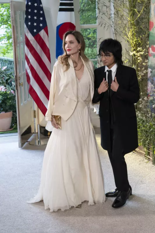 Scarlet lipstick and white dress! Angie went out with her son