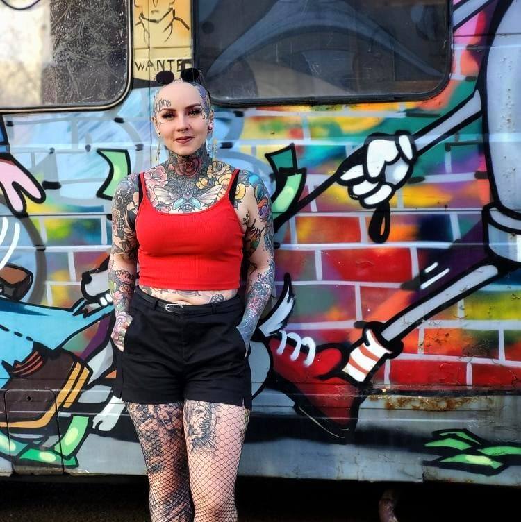 They shy away from me! photo of a nurse covering her entire body with tattoos