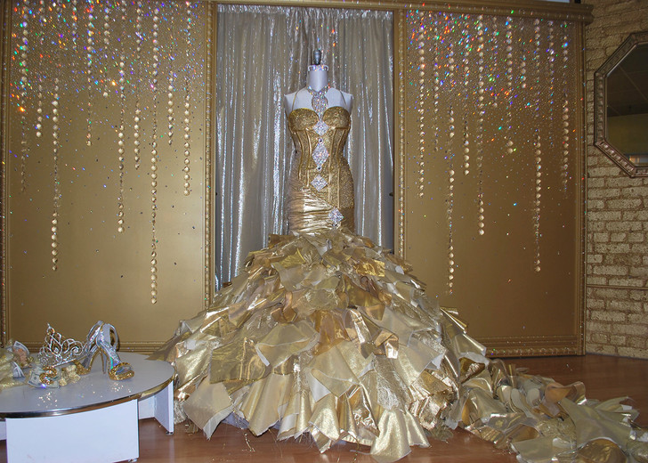 Gypsy bride married in a dress of solid gold and with a bouquet of hundred dollar bills