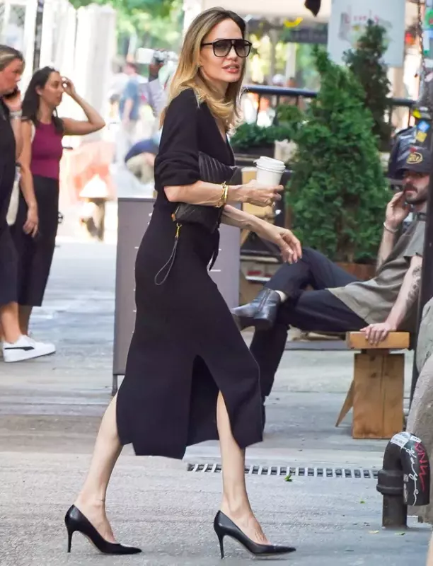 Angie in a dress with a v-neck in the nесkline was noticed on the street