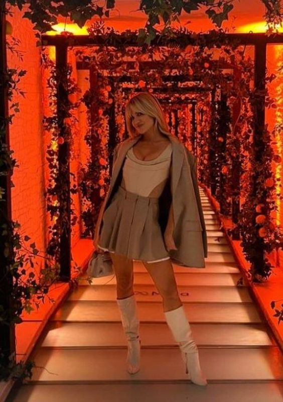 Ashley flaunts her curves in a tiny skirt and plunging corset