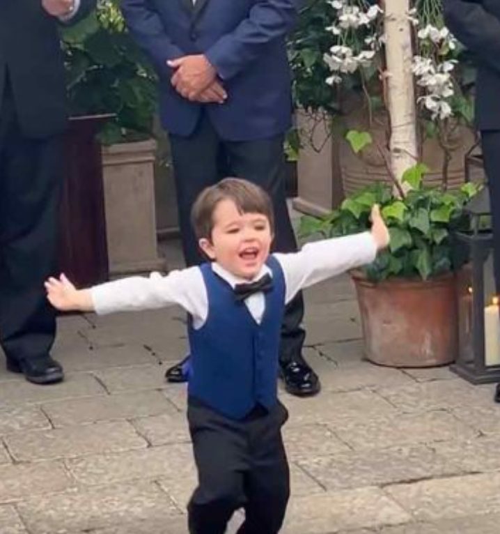 It is a lovely moment when a 2 yearold toddler sees his mother dressed as a bride!