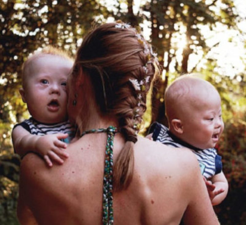 A distraught woman who was about to send her twins with Down syndrome for adoption received the best gift of all by opting out