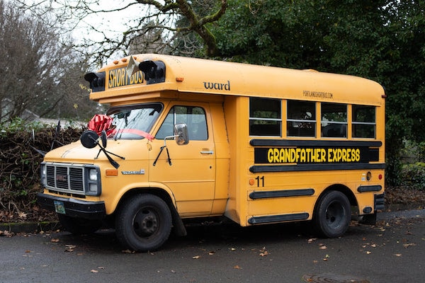 Grandpa purchased a school bus and is now transporting ten of his grandchildren to school