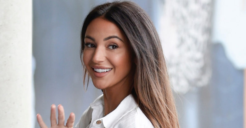 Michelle  wears a white biкini in a rare photo with husband Mark