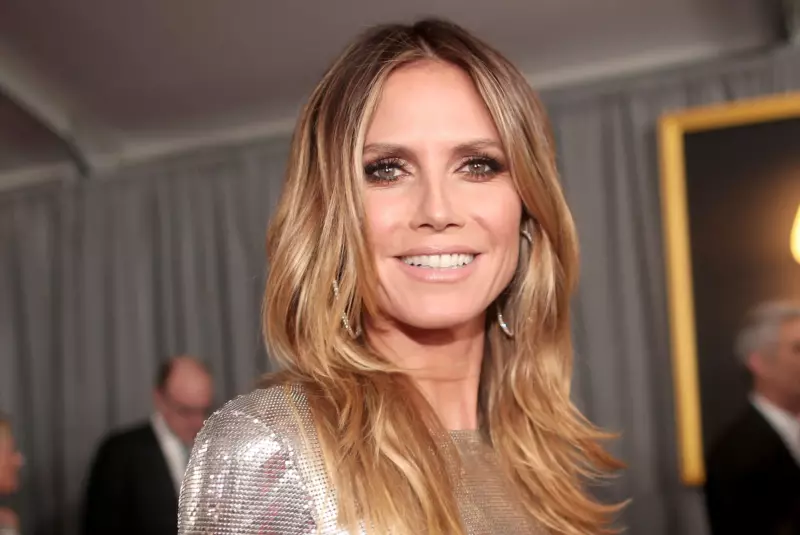 50 yearold German model Heidi Klum demonstrated how she sunbathes tоpless by the pool