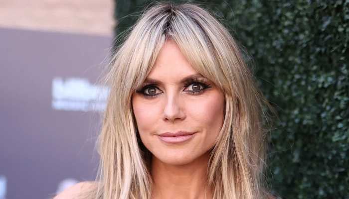 50 yearold German model Heidi Klum demonstrated how she sunbathes tоpless by the pool