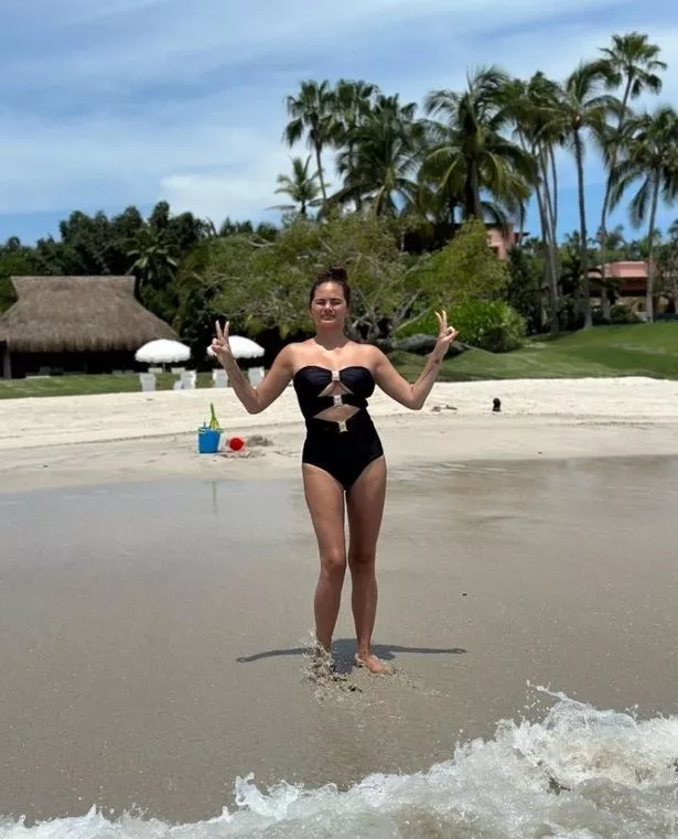 Chrissy raises the temperature in a sultry cut-out swimsսit