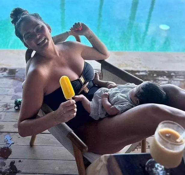 Chrissy raises the temperature in a sultry cut-out swimsսit