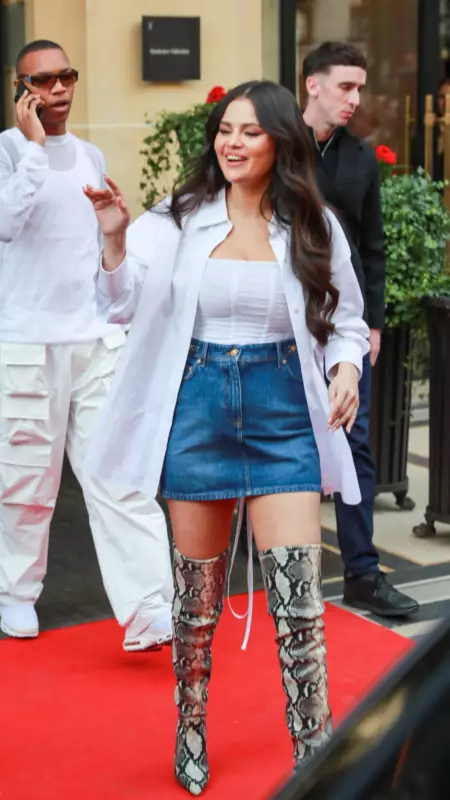 French women don't dress up like that! Selena Gomez stunned bloggers in a top, miniskirt and boots in Paris