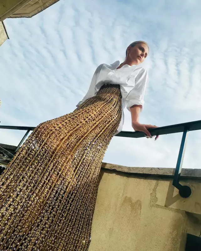 Charlize Theron in a transparent skirt appeared at a fashion show in Paris with her 11 yearold daughter