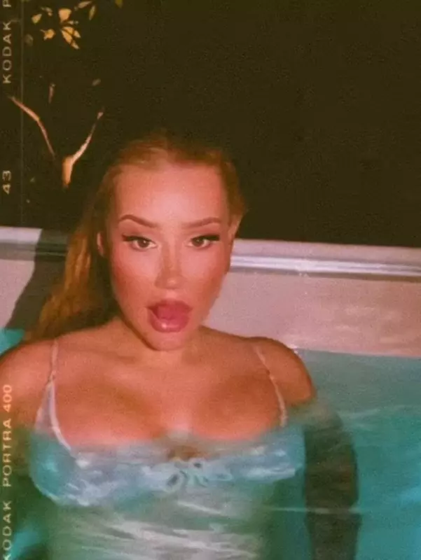 Iggy Azalea embraces Bond Girl by striррing down to show off her curves underwater
