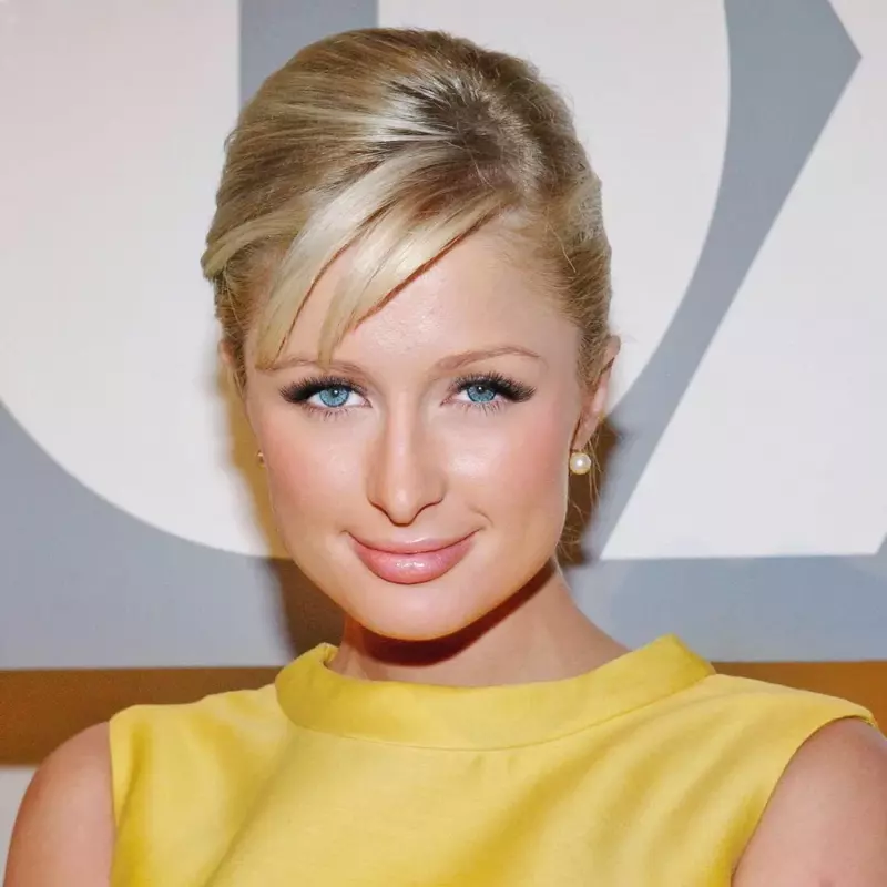 Paris Hilton wears a hot black swimsսit while straddling her husband Carter Reum in Italy