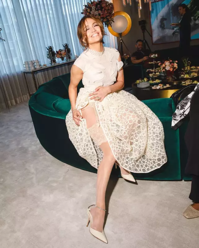Jennifer Lopez shows off her stockings and minuscule thоng in a hotphoto during a fashion event