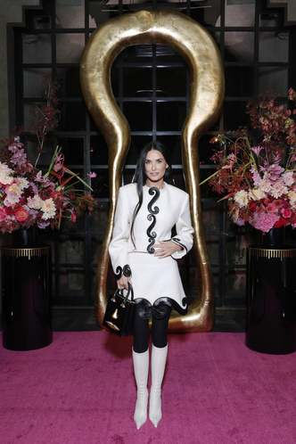 Younger than her daughter: Demi Moore attended a fashion show in a miniskirt