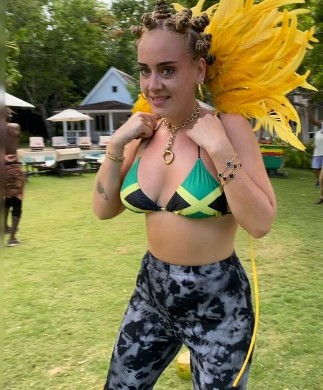 Adele slays in Jamaican flag biкini in jewelry after 100 lbs. Weight loss