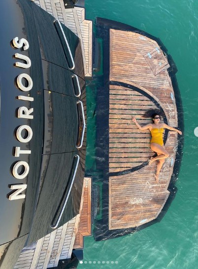 Priyanka Chopra sunbathes in a yellow swimsսit during a Dubai getaway following her fourth wedding anniversary