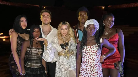 While on a birthday trip to Italy, Madonna, 66, dazzles while posing with her lover, 28-year-old Akeem Morris