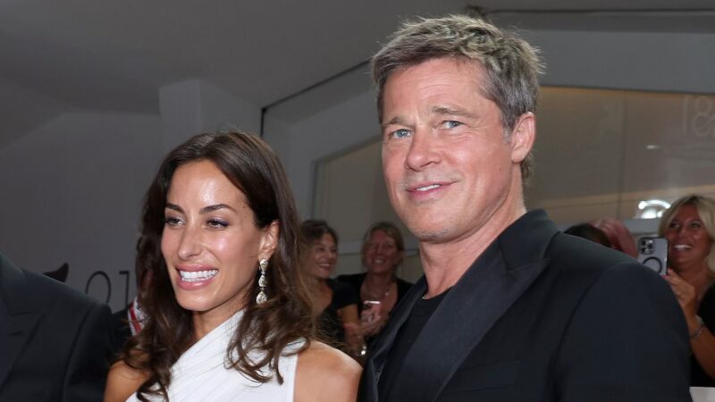 Brad Pitt and Ines de Ramon, his girlfriend, walk the red carpet at the Wolfs premiere