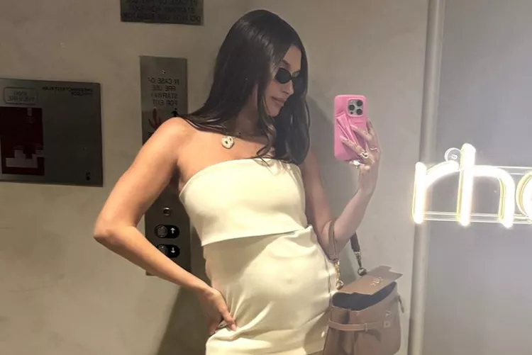 In a never-before-seen photo from When Jack Was in My Belly, Hailey Bieber displays her baby bump