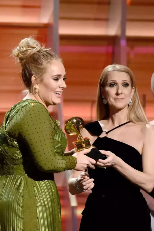 In front of her Las Vegas residency audience, Adele breaks down in tears as she embraces Céline Dion