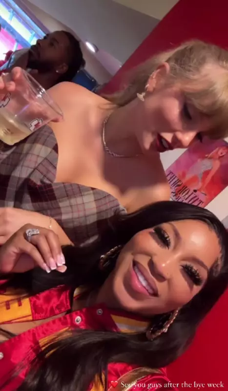 Taylor Swift says I`m sorry for photobombing myself while celebrating the perfect chiefs win next to the Eras tour poster