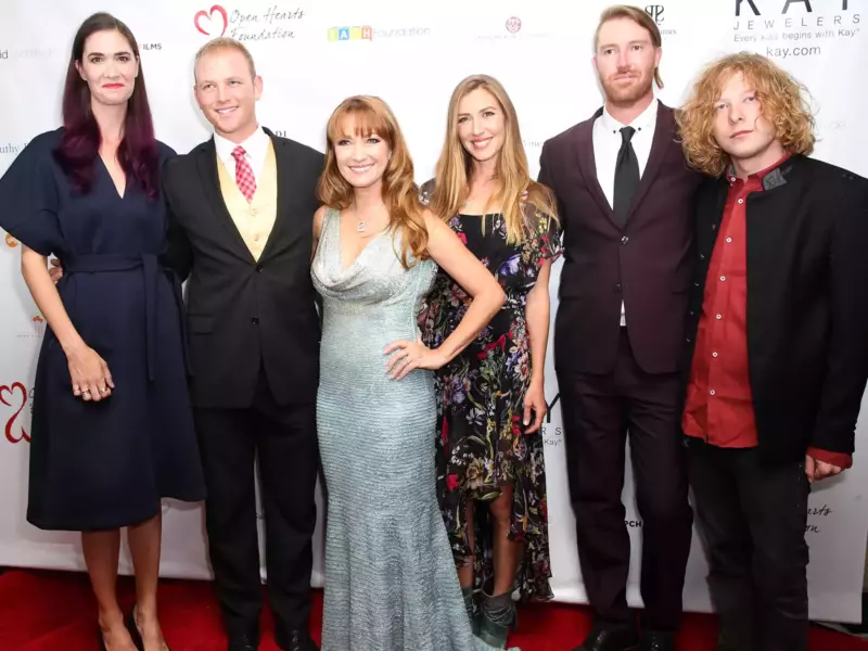 Rewearing her 2020 SAG Awards red carpet gown, Jane Seymour, 73, poses for a holiday photo with her two granddaughters
