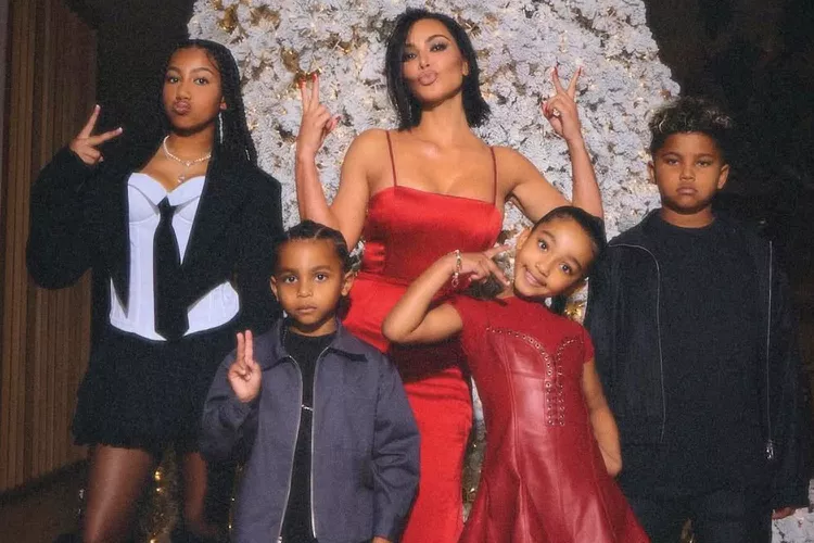 In pictures from their Christmas celebration, Kim Kardashian's four children are fully grown up, and North is almost as tall as her mother!
