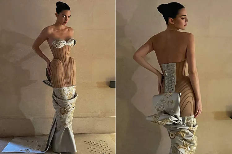 Dress of dreams, a waist-whittling gown that resembles an optical illusion, is worn by Kendall Jenner as she walks the runway
